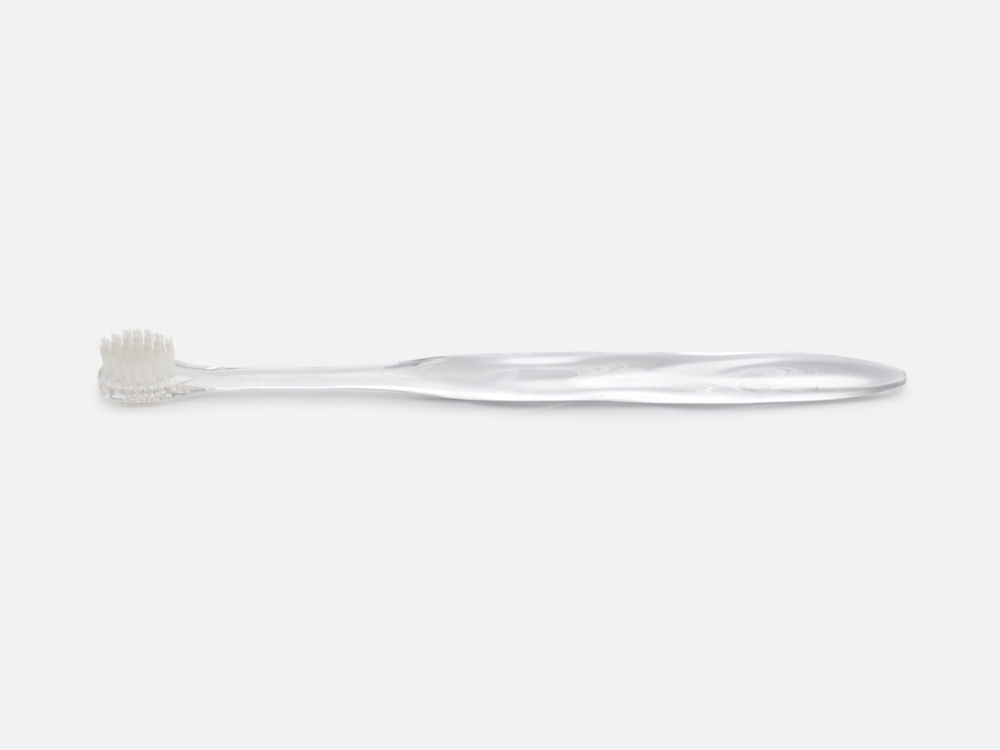 Misoka toothbrush, a transparent toothbrush shaped in a organic form from Japan House London.