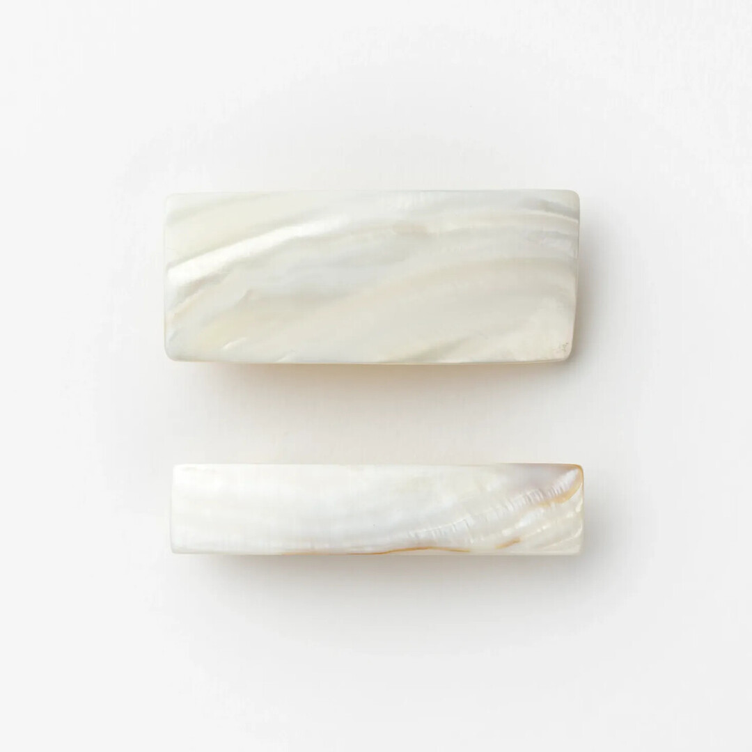 A small and medium sized pearl barrette by Jinbo Pearl from Japan House London.