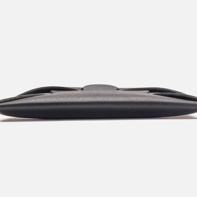 A side profile of seamless leather card holder in black from Japan House London