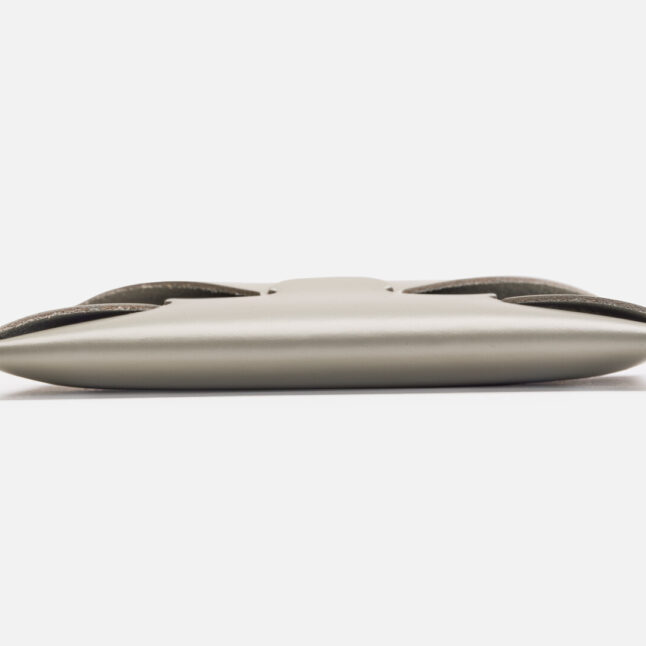 A side profile of seamless leather card holder in grey from Japan House London