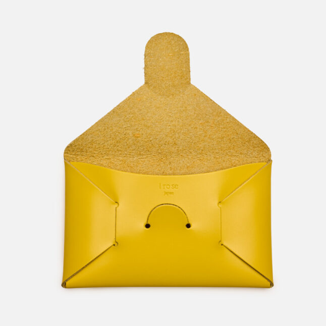 Open yellow leather seamless card holder from Japan House London