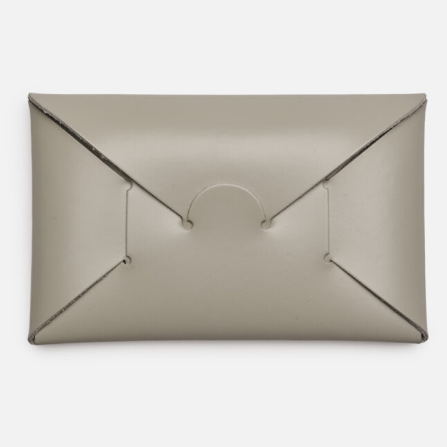 Opening of grey seamless card holder from Japan House London