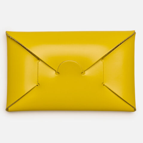 Opening of yellow seamless card holder from Japan House London