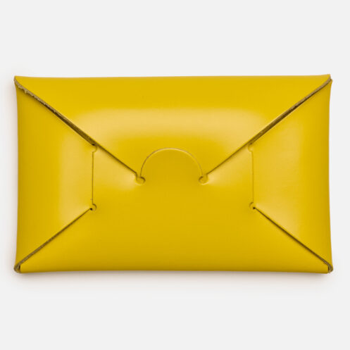 Opening of yellow seamless card holder from Japan House London
