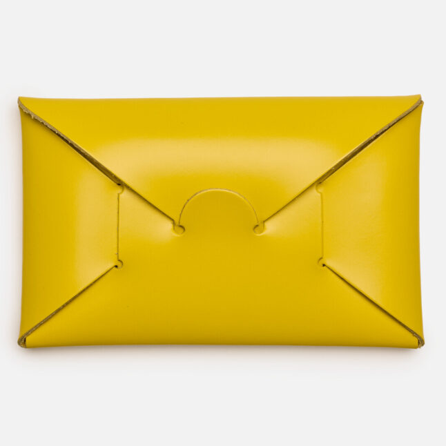 Opening of yellow seamless card holder from Japan House London