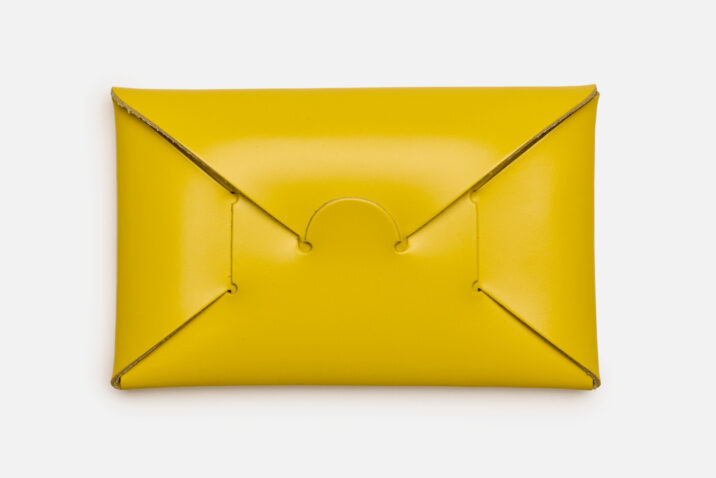 Opening of yellow seamless card holder from Japan House London