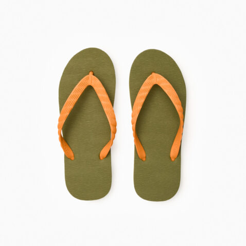 Top view of a pair of green rubber flip-flops with orange straps.