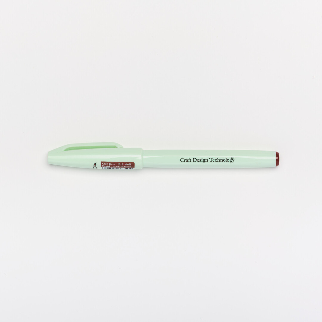 A Craft Design Technology Brush Sign Pen in brown ink