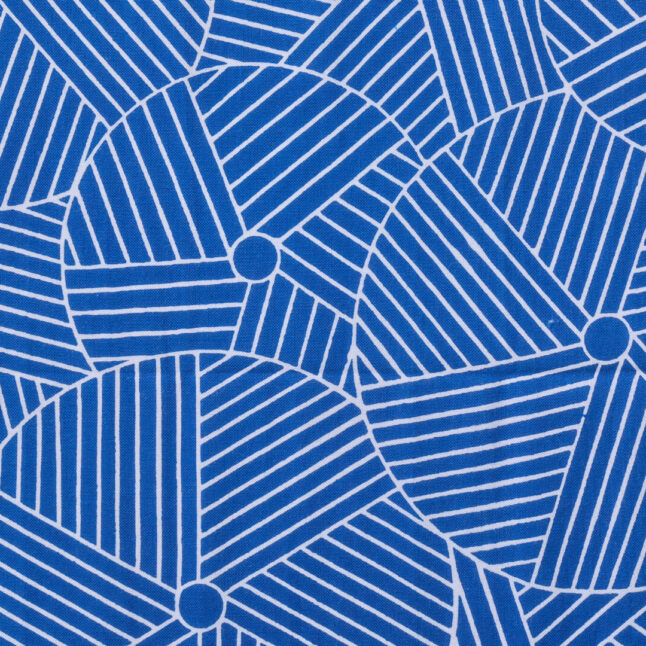 Close up of cotton fabric with white and blue pattern inspired by mortars