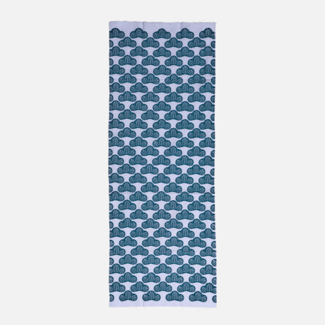 Cotton fabric with green pine tree branches pattern