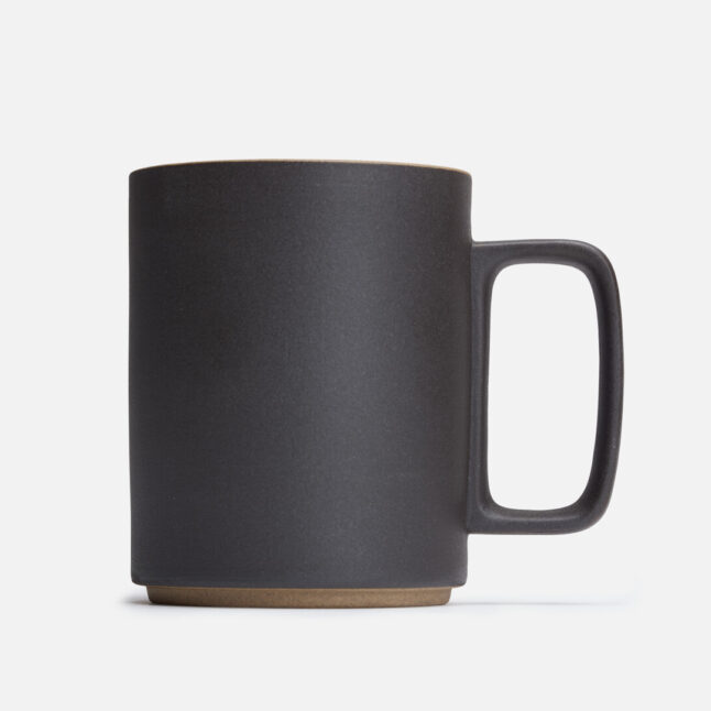 A black mug seen directly from the side