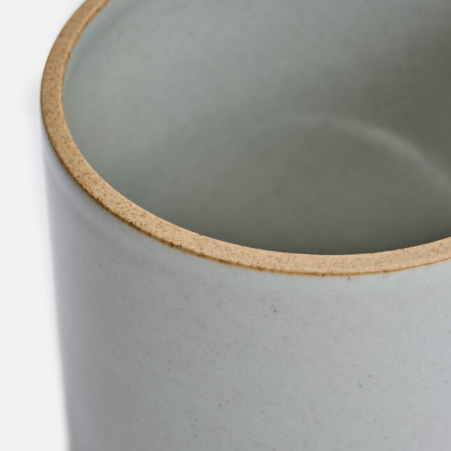 A close up of large mug with a pale grey glossy glaze seen from above