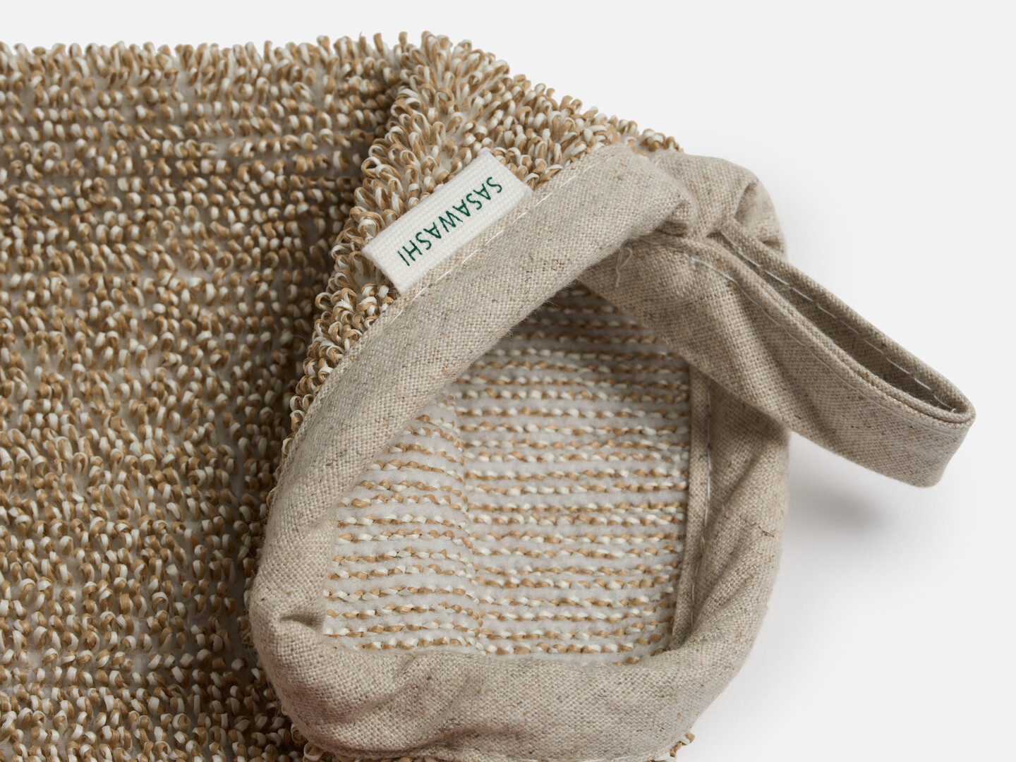 The inside of the Sasawashi Deep Scrubbing Body Mitt