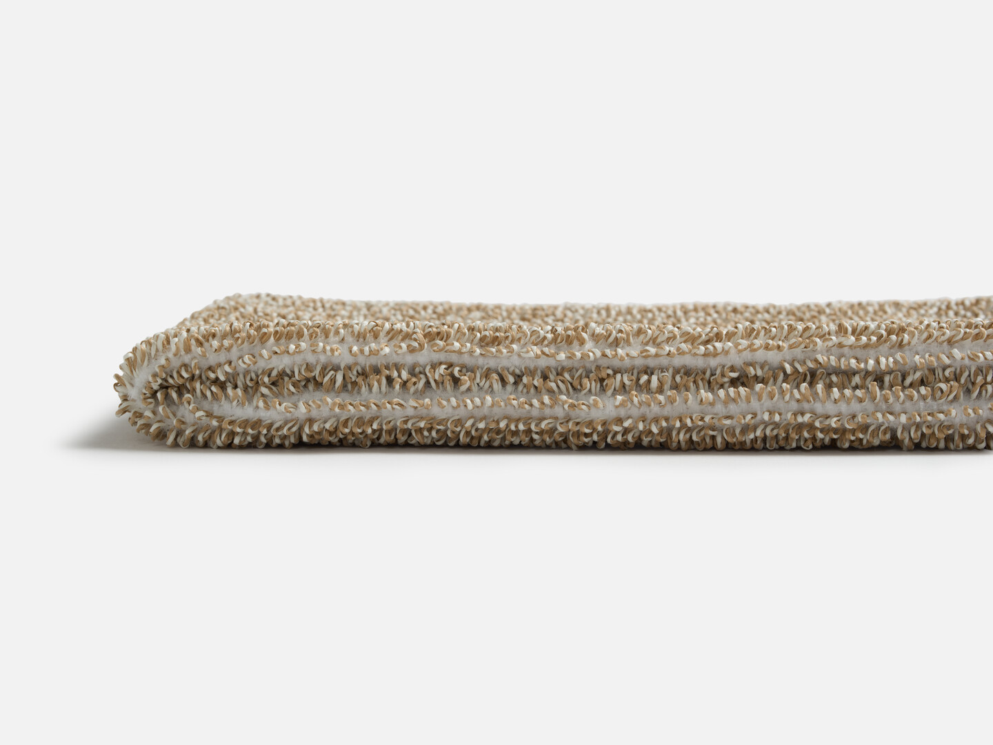 The thin profile of the Sasawashi Deep Scrubbing Body Mitt