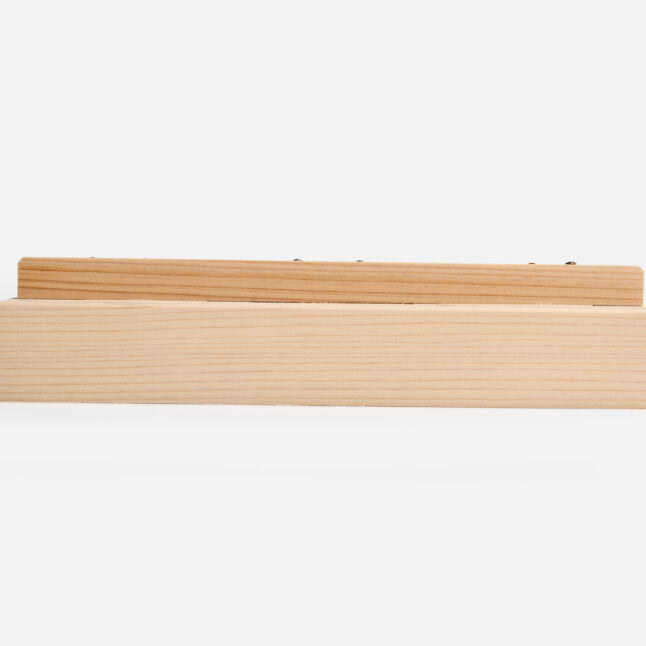 Side profile of wooden press mould from Japan House London