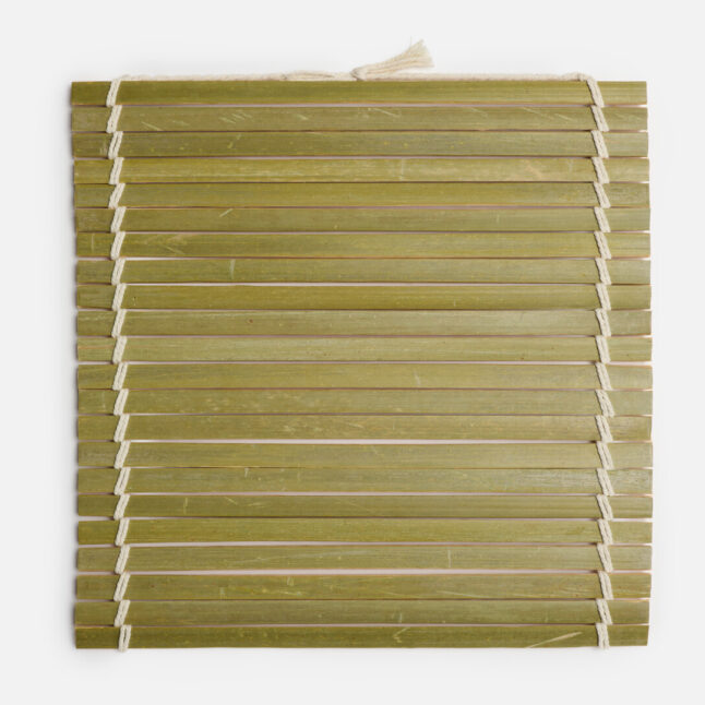 The outer side of the oni sudare rolling mat with long bamboo pieces tied with white cotton string from Japan House London