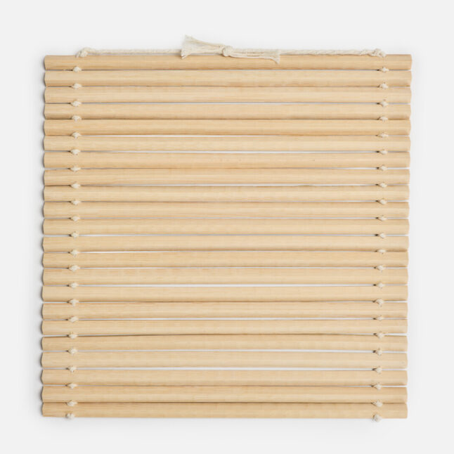 The inner side of the oni sudare rolling mat with long bamboo pieces tied with white cotton string from Japan House London
