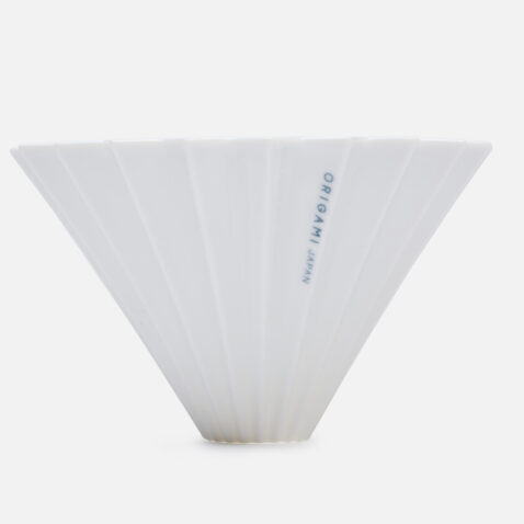 A white coffee filter holder shaped like paper folded from Japan House London.