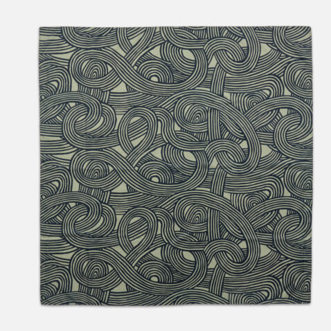 The polyester cloth has a grey lined pattern that intertwines from Japan House London.