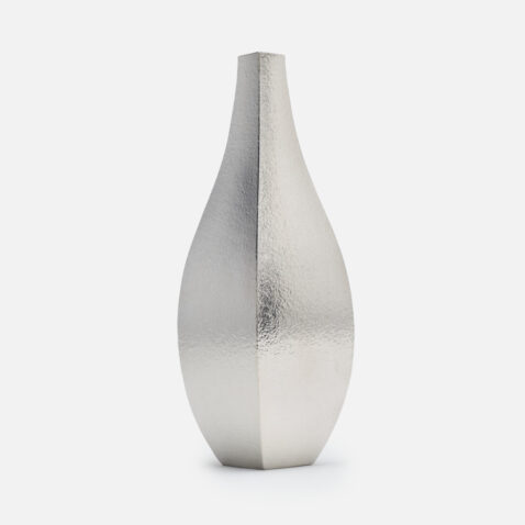 A tin vase with angular square edges from Japan House London.