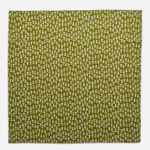 A green cotton fabric with a white pattern of gourds from Japan House London.