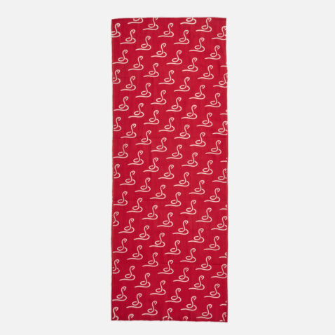 Red cotton cloths with repetitive snake patterns illustration with one white stroke from Japan House London.