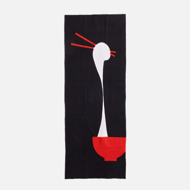 A cotton cloth with a red bowl and piece of mochi being pulled by red chopsticks from Japan House London.