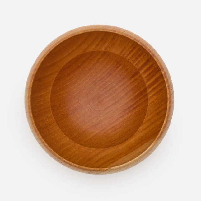 A wooden lacquered tumbler from Japan House London.