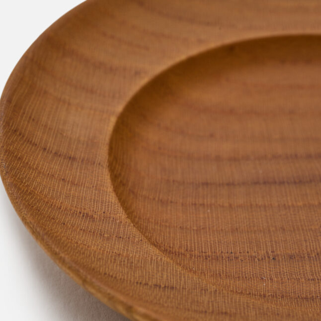 A wooden lacquered plate from Japan House London.