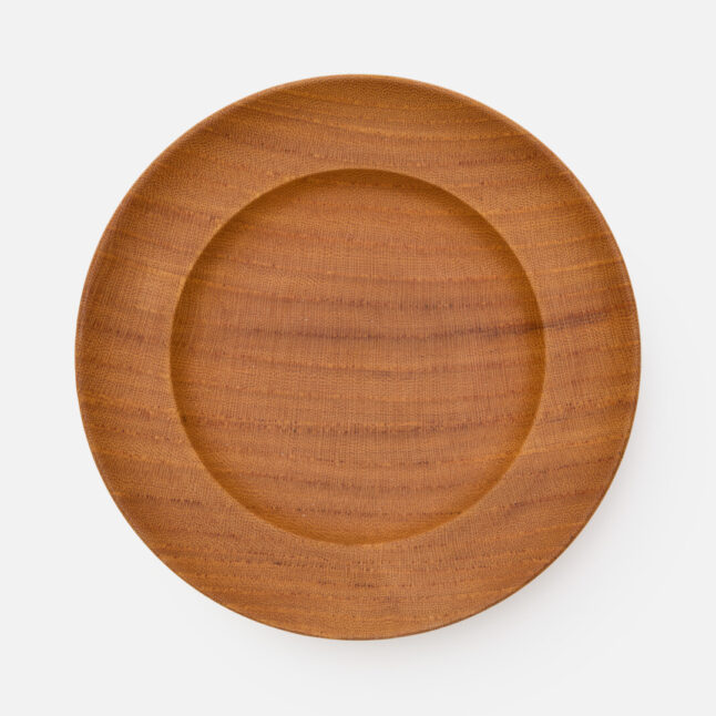 A wooden lacquered plate from Japan House London.