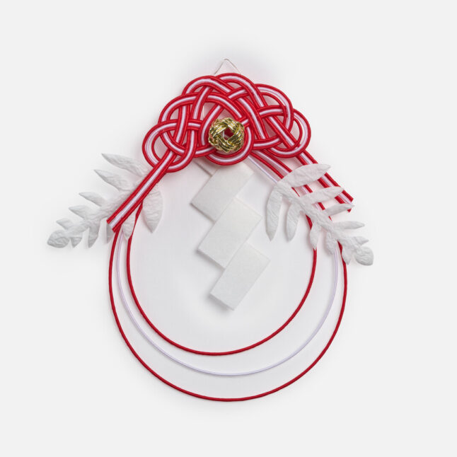 Red and white mizuhiki ornament from Japan House London.