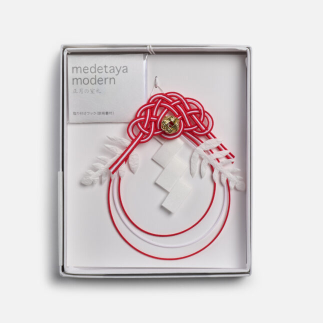 Mizuhiki ornament in a white box packaging from Japan House London.