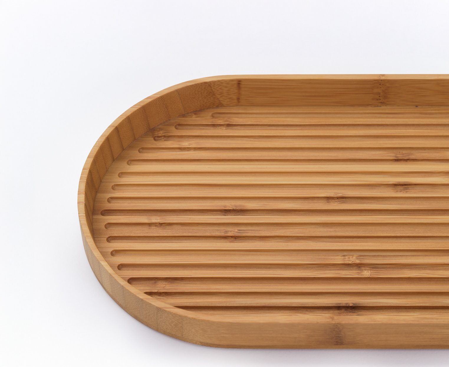 A bamboo oval tray with a ridged surface