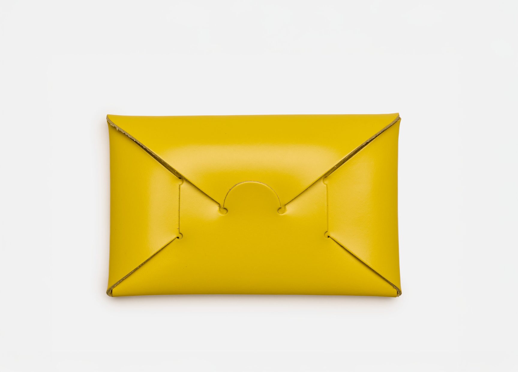 A brightly coloured yellow leather business card holder