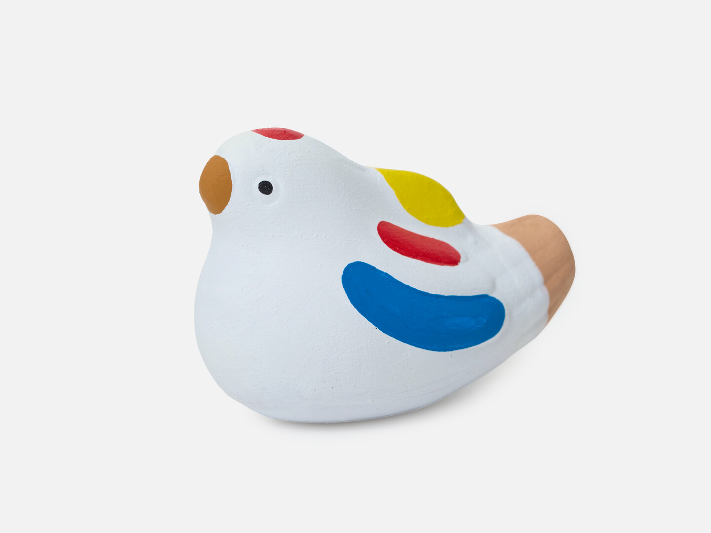 A figurine of a sparrow with a brown beak, blue, red and yellow marks on the wing and red mark on head from Japan House London.