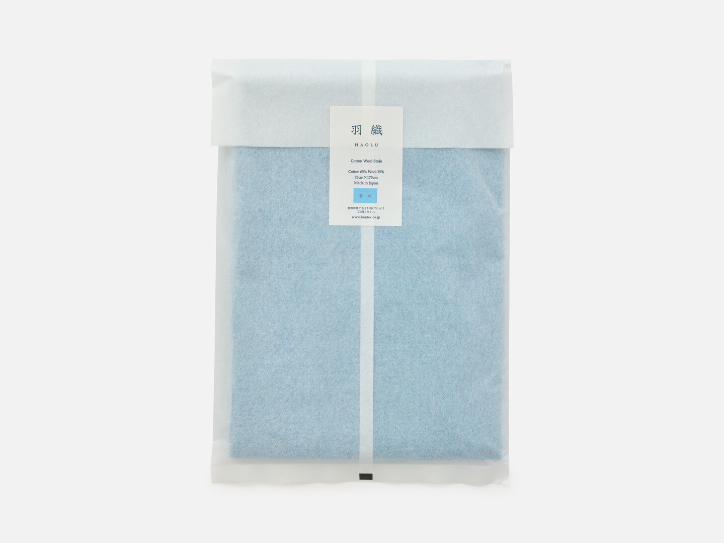 Blue scarf packaged in a white translucent paper