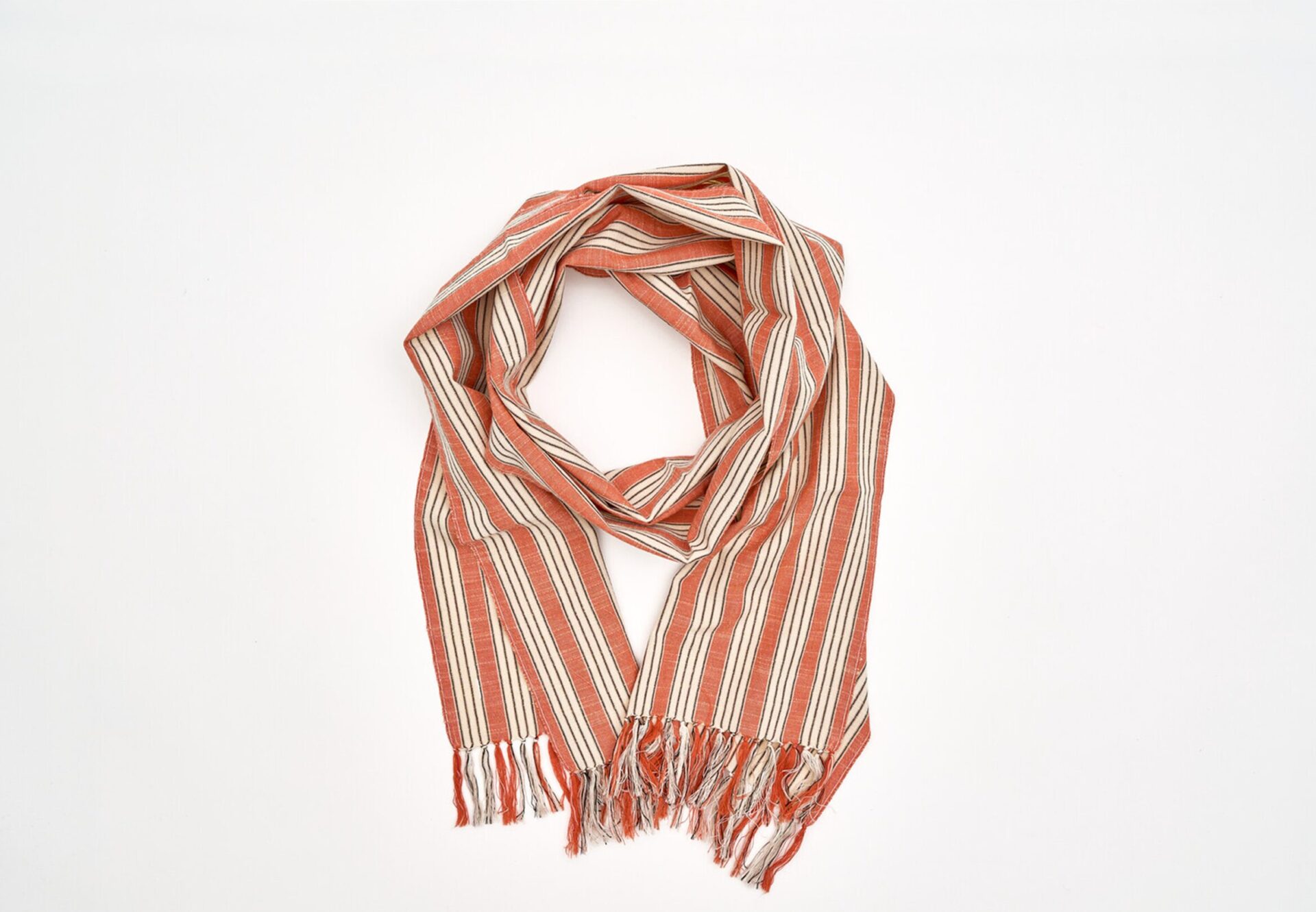 An orange and beige striped scarf