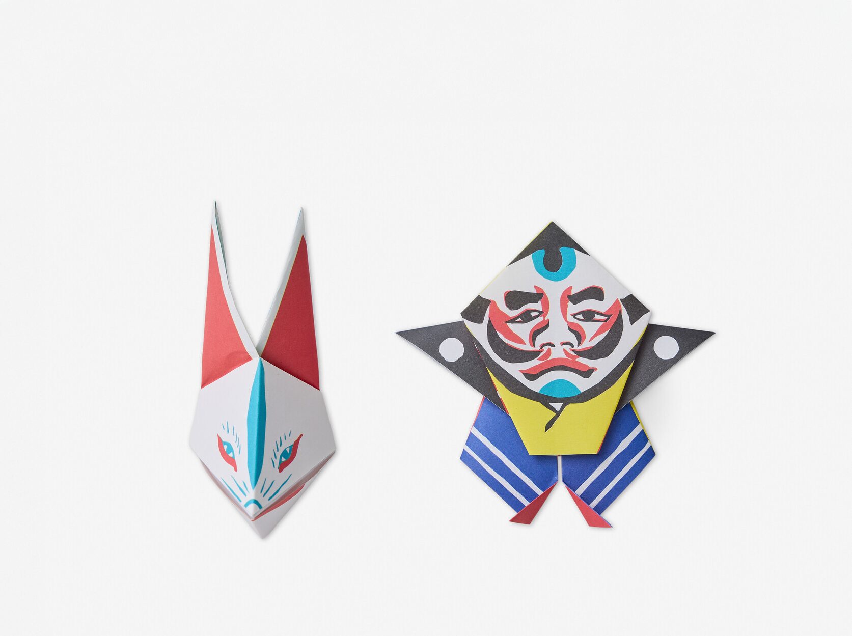 Two origami creatures, one similar to a foxes head and another a small man