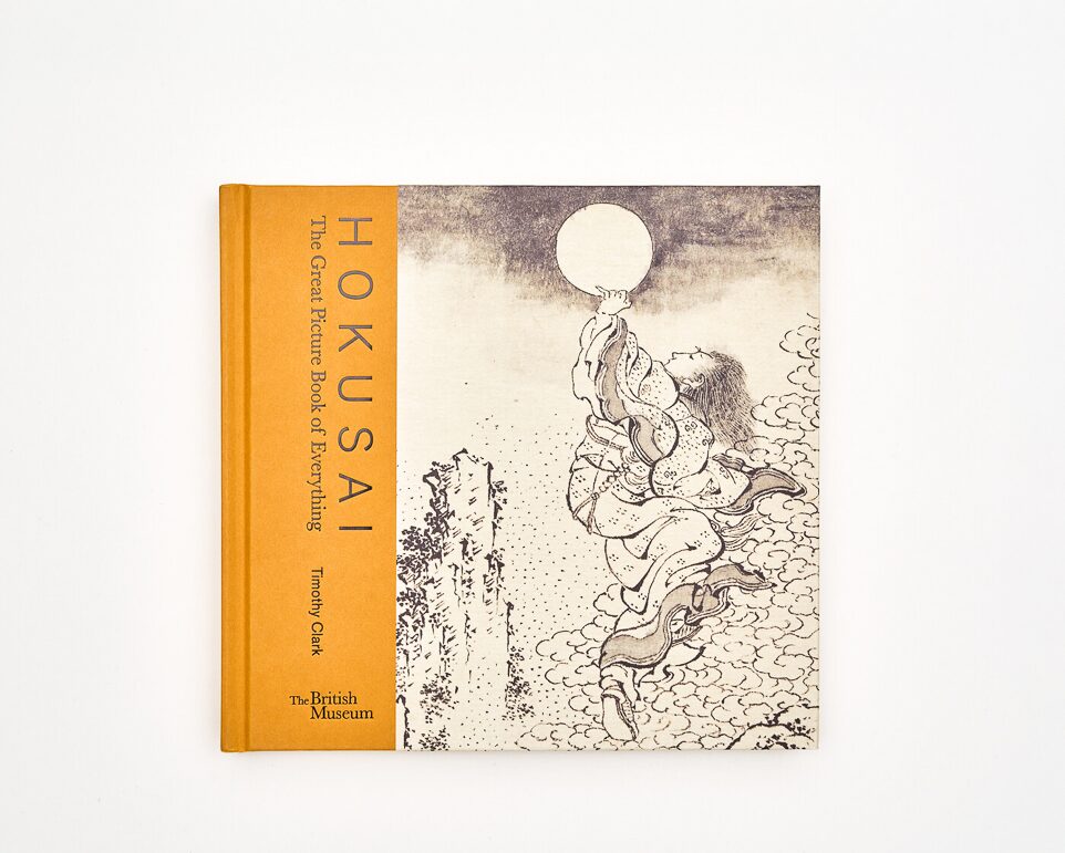 A book with an illustration of a person looking at the moon with the words Hokusai The Great Picture Book of Everything Timothy Clarke The British Museum