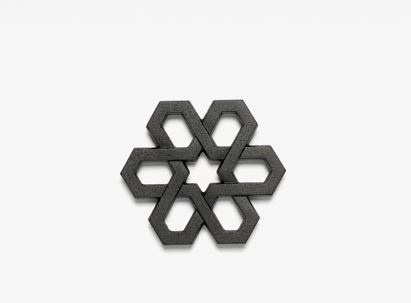 A black cast iron pot stand