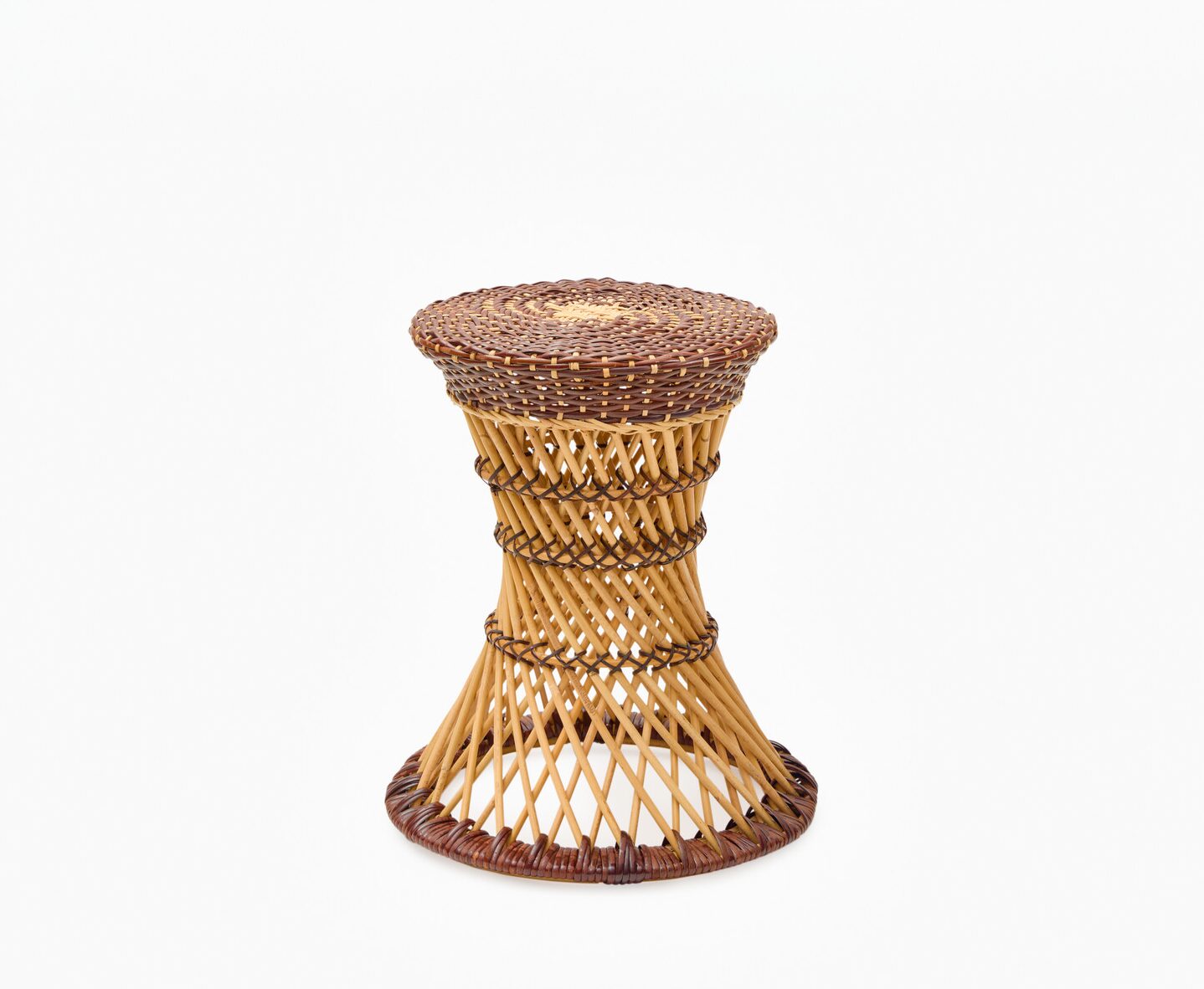 A rattan stool with intricate weaving patterns