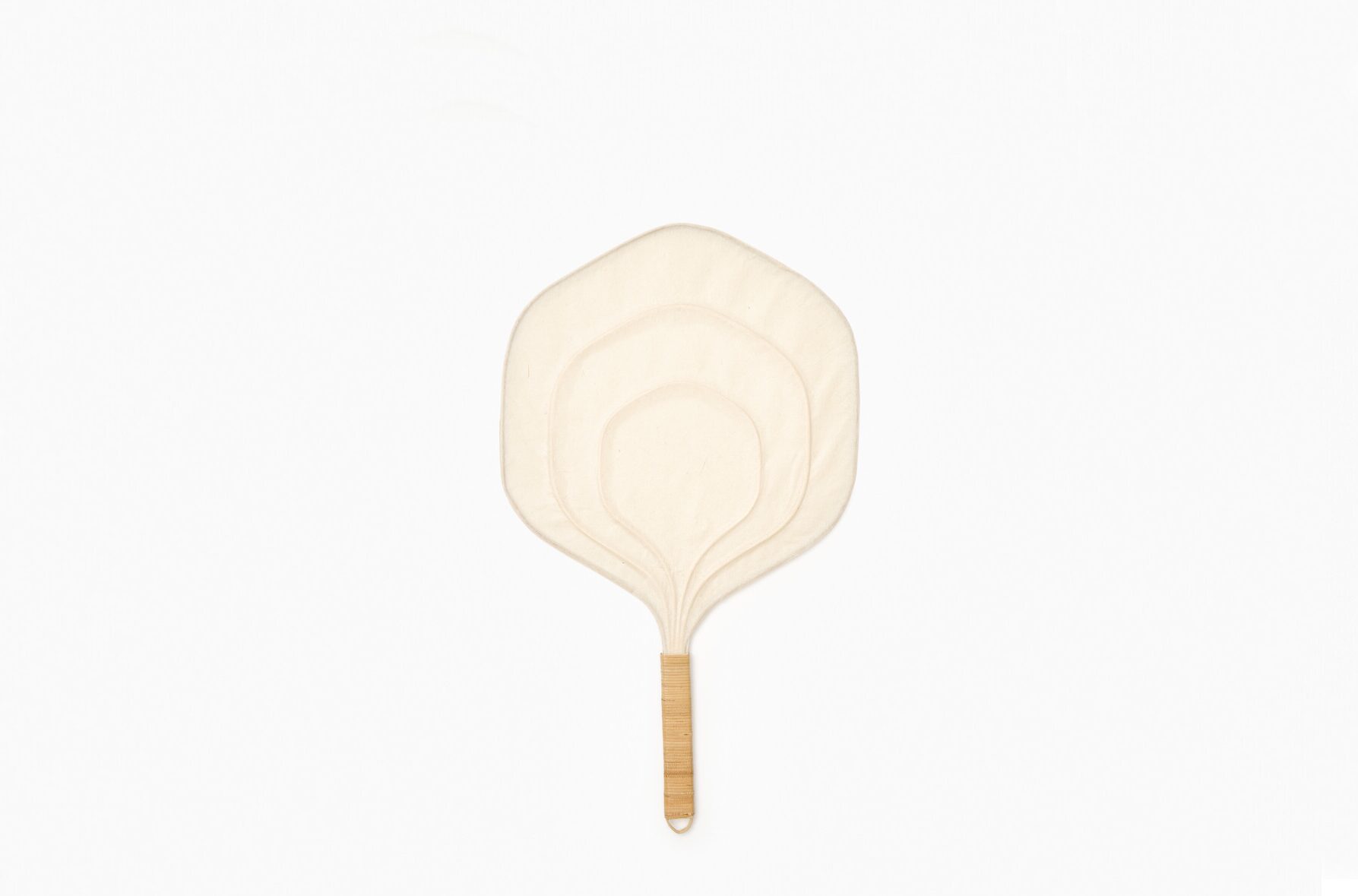 A hexagon shaped fan with a rattan handle