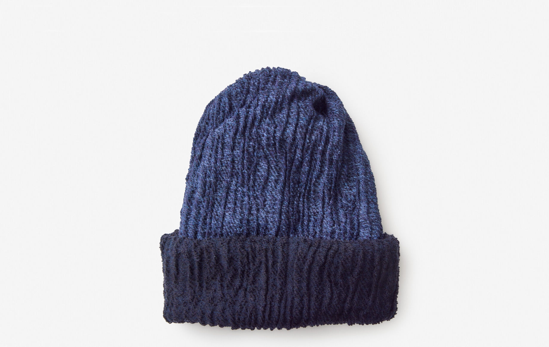 A denim coloured knitted hat with a dark navy trim