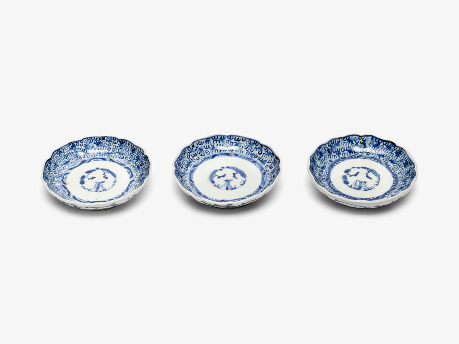 Three blue and white plates