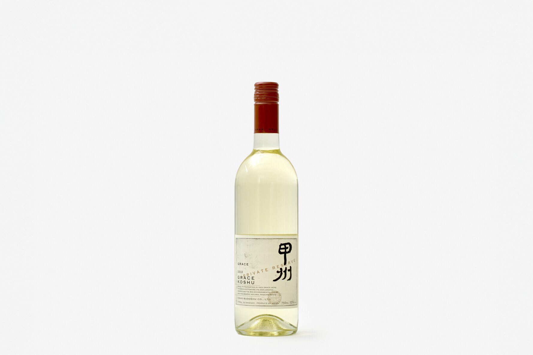 A bottle of white wine with a red lid and the label written Koshu wine Grace wine