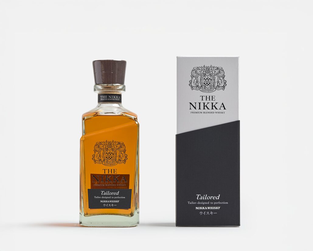 A bottle with the label Nikka Tailored Whisky next to a box with the label Nikka Tailored Whisky
