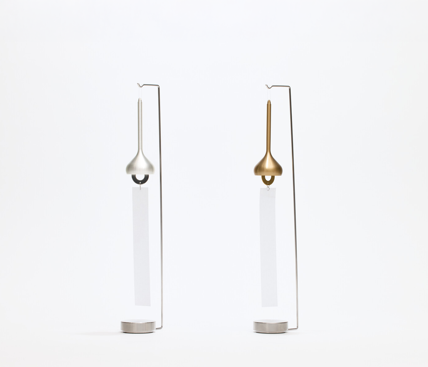 Two silver metal windchimes held with silver metal windchime holders