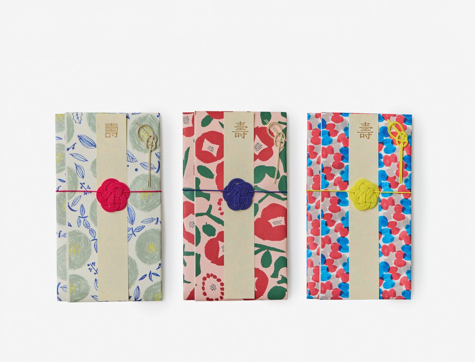 Three envelopes with brightly coloured prints