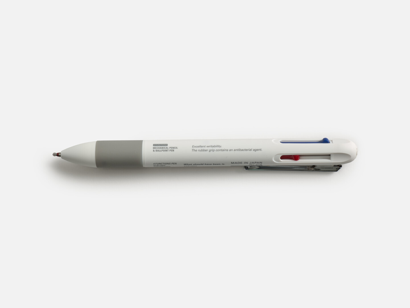 A white multifunctional pen with a grey rubber grip