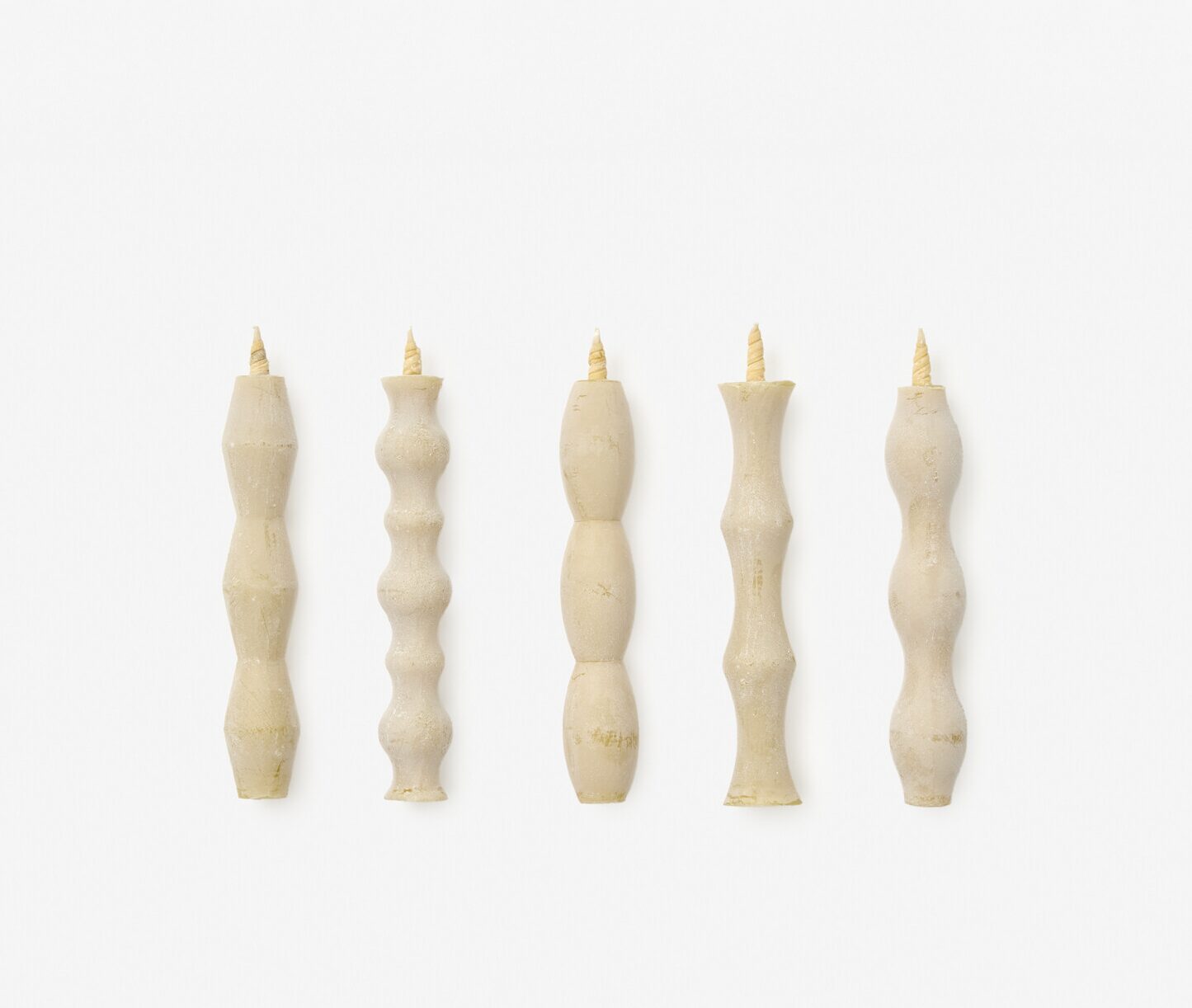 Five hand shaped white candles